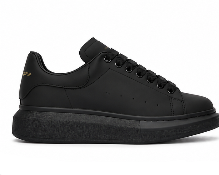 Alexander McQueen black sneaker side view on white background