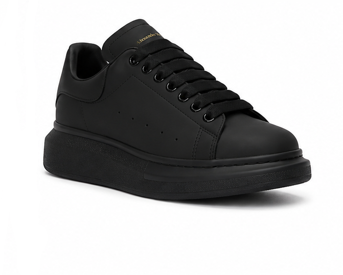 Alexander McQueen black sneaker three-quarter view on white background